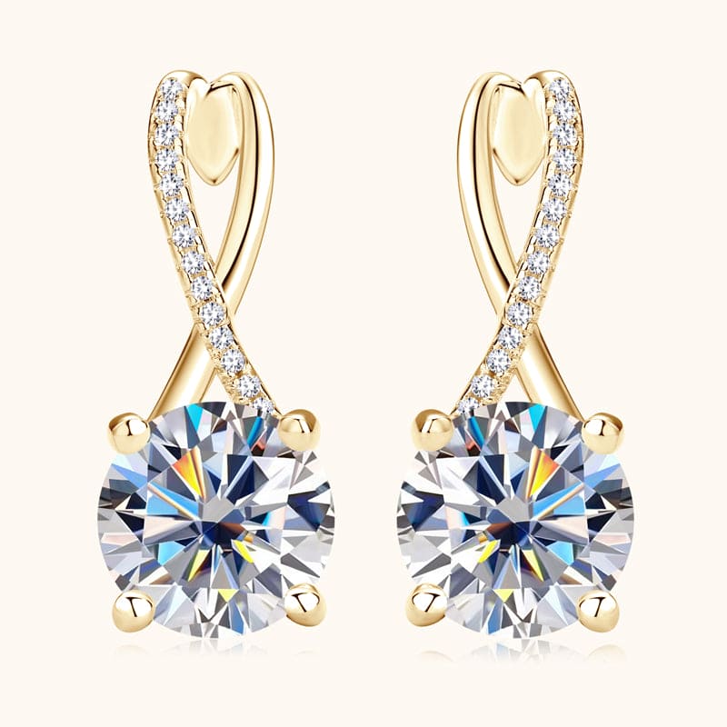 Close-up of round-cut Moissanite stone on 14k gold drop earrings