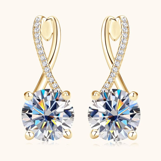 Close-up of round-cut Moissanite stone on 14k gold drop earrings